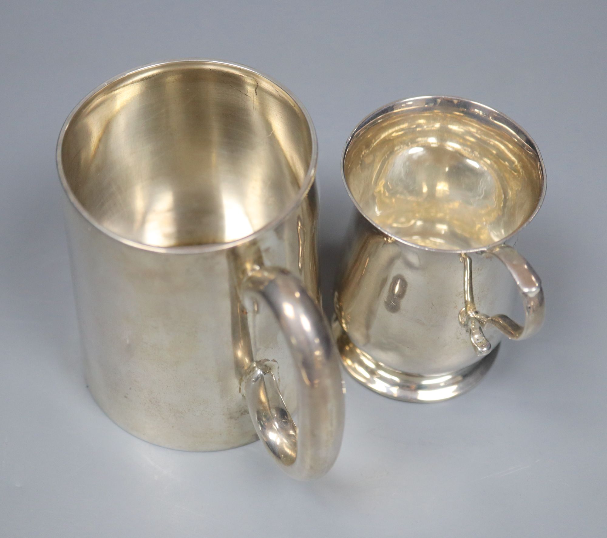 A Victorian silver christening mug, 89mm and an Edwardian silver christening mug, 76mm, gross 7.5 oz.